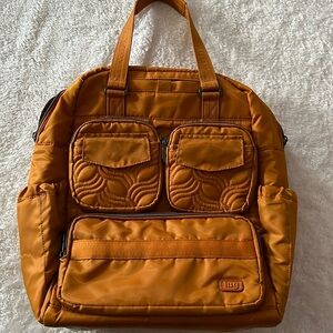 Like new Lug Jumper backpack with tote handles, gold, mustard
